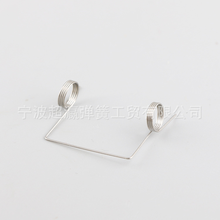 Integrated box buckle shaped spring